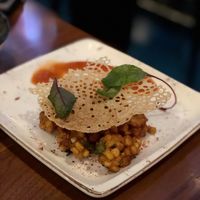 Corn tempura with sweet sour and spicy dipping sauce, served with crunchy flakes. at Waipo in Stockholm