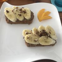 Banana bread topped with chocolate hummus, toasted pecans and banana slices at Origin  in San Pedro