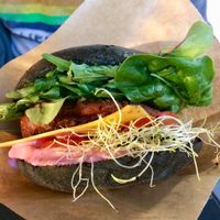 Beyond Burger with vegan cheese on charcoal bun  at Two Monkeys in Copenhagen