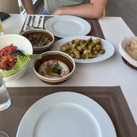 Lebanese spicy potatoes, houmous and pitta, baba ganouj and tabbouleh  at Byblos in Mellieha