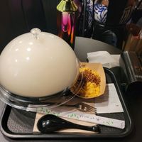 Cloud of smoke above the Ramen bowl at REDWHITE BONELESS RAMEN - Boston in Boston