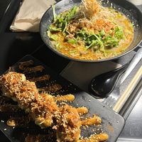 Four pieces of spicy, roasted miso avocado, with number five Yuzu sesame Ramen bowl.  at REDWHITE BONELESS RAMEN - Boston in Boston