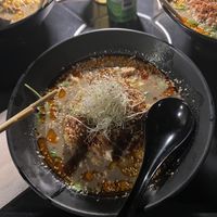 Yuzu Sesame Ramen- “Sesame taste light spicy-soboro (vegan meat and tofu), corn, onion, arugula and chilli oil.” Delicious!!!! It was so flavorful😄 at REDWHITE BONELESS RAMEN - Boston in Boston