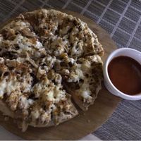 Tofu & cashew cheese pizza at Loving Hut - Vegan Paradise in Gurgaon