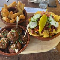 Second part of the tapas board. Fried springrolls, sticky mushrooms and loaded nachos. at Bistro Calypso in Eindhoven