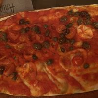 Pizza mediterranea- capers, olives, datterini amd tomato sauce  at AmaMi in Milan