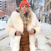 Owner wearing real fox fur at Can't Believe It's Not Meat - Hyde Park in Chicago