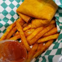 Vegan pizza puff with fries at Can't Believe It's Not Meat - Hyde Park in Chicago
