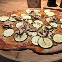 Pizza with wholemeal spelt dough,  mushrooms and zuchinni   at Mama Trattoria in Cologne