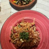 Garlic pasta with fried onions and lentils + fatouch of fresh vegetables and sumac fried pitas  at Naranj in Marrakech