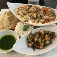 Vegetable Jalfrezi (vegan version), with Naan, Chickpea Salad, Basmati Rice and Cilantro Sauce.  Cilantro Indian Cafe at Cilantro Indian Cafe in Cary