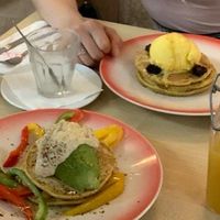 Savory pancake with hummus, bell pepper and avocado. Sweet pancake with safran-pistachio ice cream, blackberries and maple syrup. at Moak Pancakes - City Center in Amsterdam