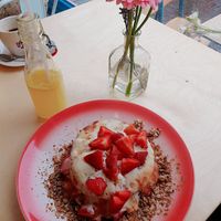 Sweet strawberry and granola pancakes 💚 at Moak Pancakes - City Center in Amsterdam