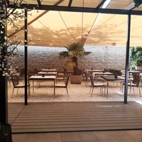 Covered outdoor seating at Le Nidaux in Nidau