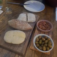 Starter- fresh bread (rosmary, ciabatta and nuts) with selfmade Kimchi and regional Olives at RE Organic in Mallorca