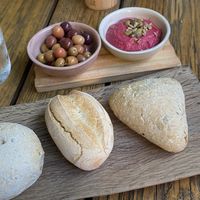 Bread with olives and humus  at RE Organic in Mallorca