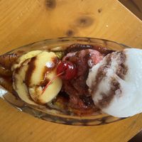 Banana split special (fried banana) with mango, chamoy, and limon ice cream scoops and vegan chocolate syrup at Root's in Cabo San Lucas