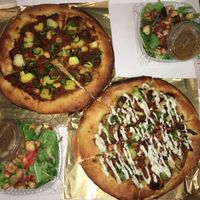 Kissoons’ Loop and Brother Wilton pizzas with side salads at Secret Pizza Society in Portland