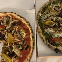 The ‘Veg’ pizza - one with basil pesto, one with a tomato base  at Marrobbio in Sliema