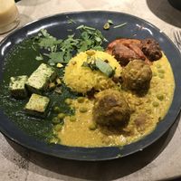 Palak tofu, butter curry with mushrooms and seitan, peas and raisins rice at Gives a Fork in Geneva