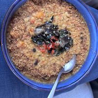 Swiss chard on red lentils cream topped with breadcrumbs  at Pele Surf Shack in Hook Of Holland