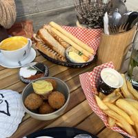 Bread basket with tapenade and butter, fries with mayo and bitterballen (oma bobs)  at Pele Surf Shack in Hook Of Holland