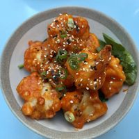 Cauliflower appetizer: cauliflower battered in rice flower, in a sweet and sour sticky sauce   at O Gambuzino in Lisbon