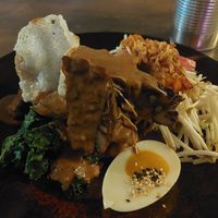 with satay sauce poured on at O Gambuzino in Lisbon