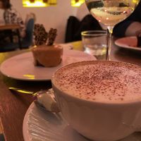 Cappuccino with vegan cheesecake   at O Gambuzino in Lisbon