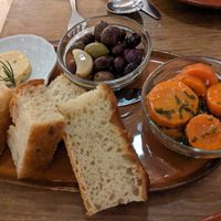Focaccia with miso butter, pickled carrots, olives at O Gambuzino in Lisbon