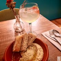hot focaccia bread with a succulent hummus! at O Gambuzino in Lisbon