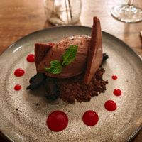 Belgian chocolate mousse, baked cocoa meringue, chocolate crumb and blackberries. at O Gambuzino in Lisbon