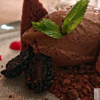 Belgian chocolate mousse, baked cocoa meringue, chocolate crumb and blackberries. at O Gambuzino in Lisbon