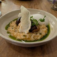 'Sea' rice with cilantro oil, mushrooms, and foam at O Gambuzino in Lisbon