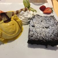 Brownie, mango sorbet and vegan whipped cream at Schröders at Kurhaus am Inselsee in Guestrow