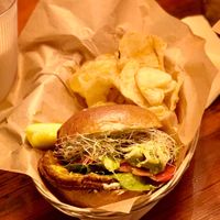 Bun, hummus spread and veggie burger all house-made, topped with mustard, sprouts, tomato and avocado.  at The Yellow Deli  in Rutland