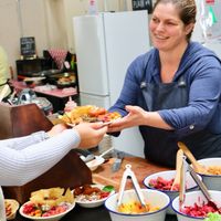 Ananda serving up more delicious vegan goodness. at Vege Pulse in Auckland