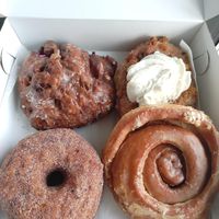 Apple fritter, carrot cake, cinnamon cronut, apple cider roll at Machino Donuts - Bloor St in Toronto