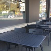 Outside seating (nearby road not seen) at Dieci Pizza - Obergrundstrasse in Luzern