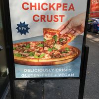 Placard advertising Vegan, gluten free pizza. at Oath Pizza in New York City