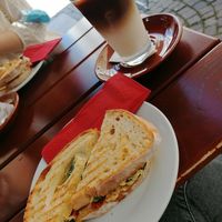 Panini mit Hummus und Grillgemüse. Iced-Hafer-Latte at Café Pavillon in Loerrach