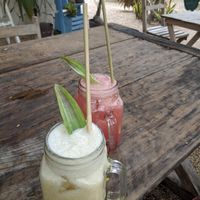 Pineapple and watermelon aguas frescas with plant straws! at Los Bowls de Guadalupe  in Tulum