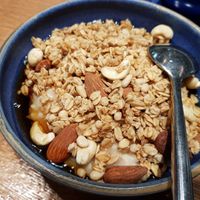 Nutty porridge with gralona and syrup on top at Haferkater - S-Bf Friedrichstraße in Berlin