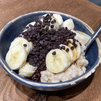 Vegan chocolate and banana oatmeal bowl  at Haferkater - S-Bf Friedrichstraße in Berlin