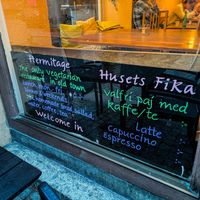 Sign facing out of front window at Hermitage at Hermitage in Stockholm