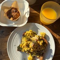 Vegan banana muffin, avocado toast with tofu scramble, orange juice.  at Harvest on 25th in Waco