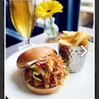 Official photo of jackfruit burger from their website.  at The Drapers Arms in Canterbury