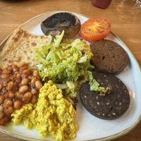 Vegan breakfast, including mushrooms, tomato, potato bread, tofu scramble, vegan black pudding, vegan haggis, (homemade!) baked beans and cabbagee  at Loudons Cafe and Bakery - New Waverley in Edinburgh