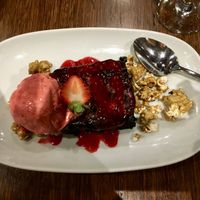 Beautifully rich vegan chocolate brownie with raspberry sorbet and popcorn. at Old Boundary Hotel in Bendigo
