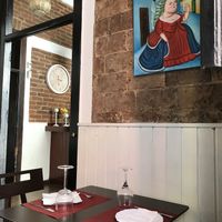 The place is cozy and has some Paintings un Boteros’s style, perhaps to prevent people from eating too much  at 18 Grados in Gran Canaria
